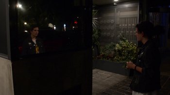 Movie still from “Arctic Monkeys - Why’d You Only Call Me When You’re High?” (2013), directed by Nabil Elderkin – Medium shot, Over the shoulder angle