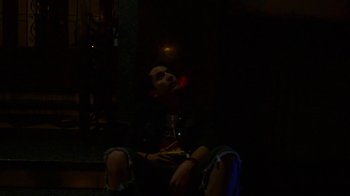 Movie still from “Arctic Monkeys - Why’d You Only Call Me When You’re High?” (2013), directed by Nabil Elderkin – Medium shot, Low angle