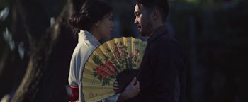 Movie still from “Kye Kye - Honest Affection” (2013), directed by Salomon Ligthelm – Medium shot, Over the shoulder angle