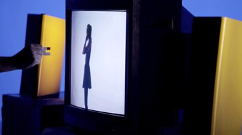 Movie still from “Hook N Sling & Chris Willis - Magnet” (2013), directed by Ryan Staake – Medium shot, Low angle