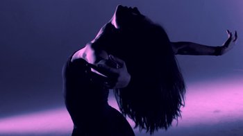 Movie still from “Hook N Sling & Chris Willis - Magnet” (2013), directed by Ryan Staake – Medium shot, Low angle