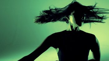 Movie still from “Hook N Sling & Chris Willis - Magnet” (2013), directed by Ryan Staake – Medium shot, Low angle