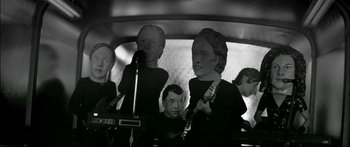 Movie still from “Arcade Fire - Reflektor” (2013), directed by Anton Corbijn – Medium shot, High angle