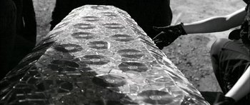 Movie still from “Arcade Fire - Reflektor” (2013), directed by Anton Corbijn – Extreme Close Up shot, Overhead angle