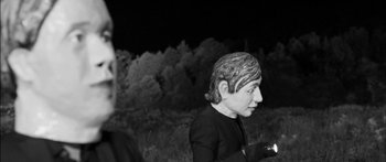 Movie still from “Arcade Fire - Reflektor” (2013), directed by Anton Corbijn – Extreme Close Up shot, Over the shoulder angle