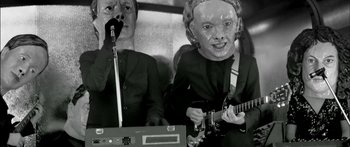 Movie still from “Arcade Fire - Reflektor” (2013), directed by Anton Corbijn – Close Up shot, Low angle