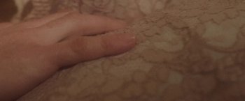 Movie still from “Dawn Golden - All I Want” (2013), directed by Tyler T. Williams – Extreme Close Up shot, Overhead angle