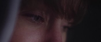 Movie still from “Dawn Golden - All I Want” (2013), directed by Tyler T. Williams – Extreme Close Up shot, High angle