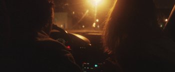 Movie still from “Dawn Golden - All I Want” (2013), directed by Tyler T. Williams – Extreme Close Up shot, Over the shoulder angle
