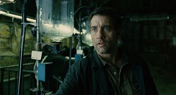 Movie still from “Children of Men” (2006), directed by Alfonso Cuarón – A person wearing a jacket; Close Up shot, Low angle
