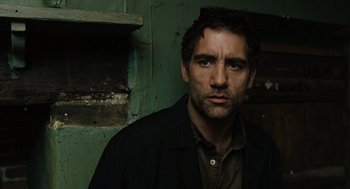 Movie still from “Children of Men” (2006), directed by Alfonso Cuarón – A person wearing a jacket; Close Up shot, Low angle