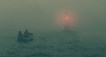 Movie still from “Children of Men” (2006), directed by Alfonso Cuarón – A man rowing a boat in the middle of the night; Extreme Wide shot, High angle