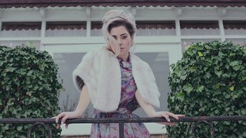Movie still from “Marina And The Diamonds - Primadonna” (2012), directed by Casper Balslev – Medium shot, Low angle