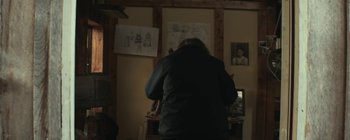 Movie still from “Bon Iver - Towers” (2011), directed by Nabil Elderkin – Medium shot, Low angle