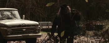 Movie still from “Bon Iver - Towers” (2011), directed by Nabil Elderkin – Medium shot, Low angle