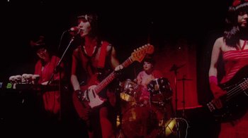 Movie still from “The Suzan - Devils” (2011), directed by Ryan Staake – Medium shot, Low angle