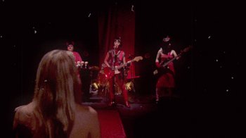 Movie still from “The Suzan - Devils” (2011), directed by Ryan Staake – Medium shot, Over the shoulder angle