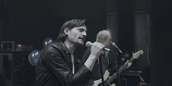 Movie still from “The Floor Is Made Of Lava - Leave Me Now” (2011), directed by Casper Balslev – Medium shot, Low angle