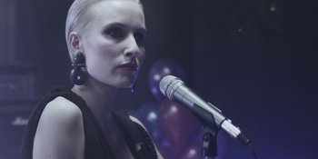 Movie still from “The Floor Is Made Of Lava - Leave Me Now” (2011), directed by Casper Balslev – Close Up shot, Low angle