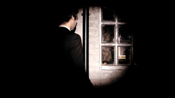 Movie still from “Mirrors - Into The Heart” (2011), directed by Us – Medium shot, Over the shoulder angle