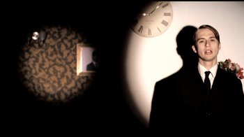Movie still from “Mirrors - Into The Heart” (2011), directed by Us – Medium shot, Low angle
