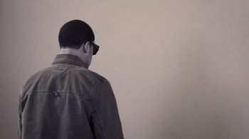 Movie still from “Dels - Trumpalump” (2010), directed by Us – Medium shot, Low angle