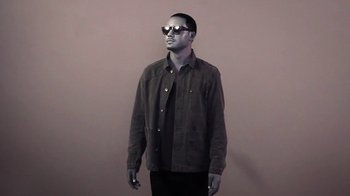 Movie still from “Dels - Trumpalump” (2010), directed by Us – Medium shot, Low angle