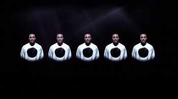 Movie still from “Dels - Shapeshift” (2010), directed by Us – Medium shot, Overhead angle