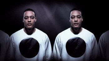 Movie still from “Dels - Shapeshift” (2010), directed by Us – Close Up shot, Overhead angle