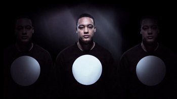 Movie still from “Dels - Shapeshift” (2010), directed by Us – Medium shot, Overhead angle