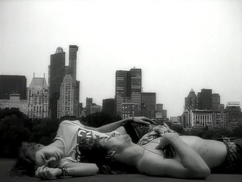 Movie still from “The Rolling Stones - Love Is Strong” (1994), directed by David Fincher – Wide shot, Low angle
