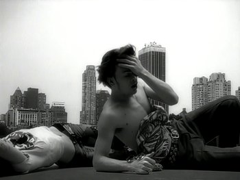 Movie still from “The Rolling Stones - Love Is Strong” (1994), directed by David Fincher – Medium shot, Low angle