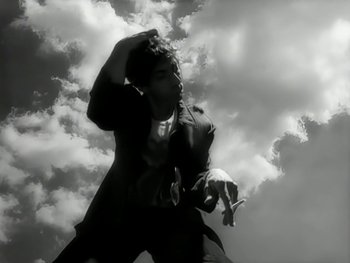 Movie still from “The Rolling Stones - Love Is Strong” (1994), directed by David Fincher – Medium shot, Low angle