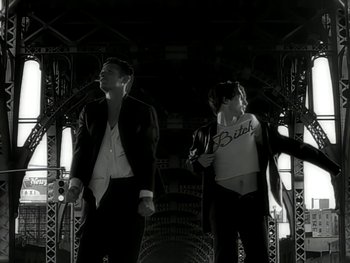 Movie still from “The Rolling Stones - Love Is Strong” (1994), directed by David Fincher – Medium shot, Low angle