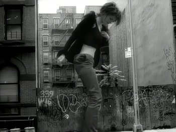 Movie still from “The Rolling Stones - Love Is Strong” (1994), directed by David Fincher – Medium shot, Low angle