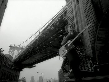 Movie still from “The Rolling Stones - Love Is Strong” (1994), directed by David Fincher – Wide shot, Low angle