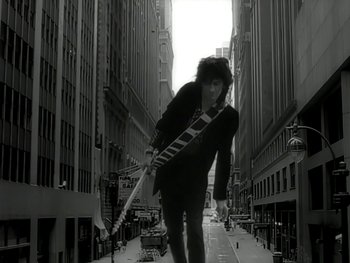 Movie still from “The Rolling Stones - Love Is Strong” (1994), directed by David Fincher – Wide shot, Low angle