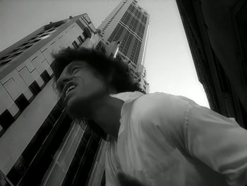 Movie still from “The Rolling Stones - Love Is Strong” (1994), directed by David Fincher – Medium shot, Low angle