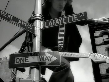 Movie still from “The Rolling Stones - Love Is Strong” (1994), directed by David Fincher – Extreme Close Up shot, Low angle