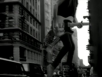 Movie still from “The Rolling Stones - Love Is Strong” (1994), directed by David Fincher – Wide shot, Low angle