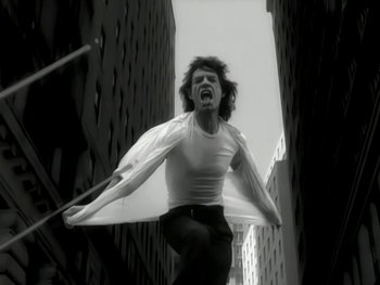 Movie still from “The Rolling Stones - Love Is Strong” (1994), directed by David Fincher – Medium shot, Low angle