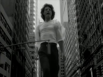 Movie still from “The Rolling Stones - Love Is Strong” (1994), directed by David Fincher – Medium shot, Low angle