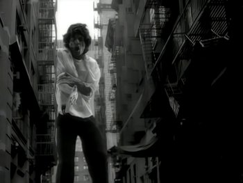 Movie still from “The Rolling Stones - Love Is Strong” (1994), directed by David Fincher – Medium shot, Low angle