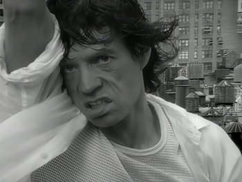 Movie still from “The Rolling Stones - Love Is Strong” (1994), directed by David Fincher – Close Up shot, Low angle