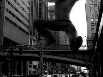 Movie still from “The Rolling Stones - Love Is Strong” (1994), directed by David Fincher – Wide shot, Low angle