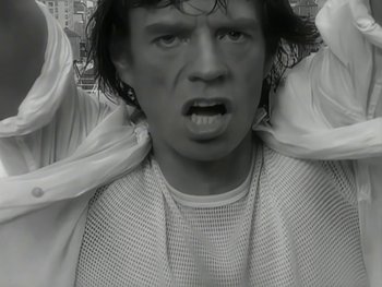 Movie still from “The Rolling Stones - Love Is Strong” (1994), directed by David Fincher – Close Up shot, Low angle