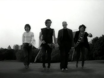 Movie still from “The Rolling Stones - Love Is Strong” (1994), directed by David Fincher – Wide shot, Low angle