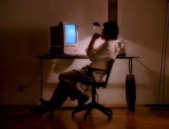 Movie still from “Billy Idol - Cradle Of Love” (1990), directed by David Fincher – Medium shot, High angle