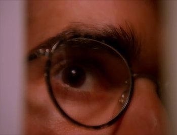 Movie still from “Billy Idol - Cradle Of Love” (1990), directed by David Fincher – Extreme Close Up shot, Overhead angle