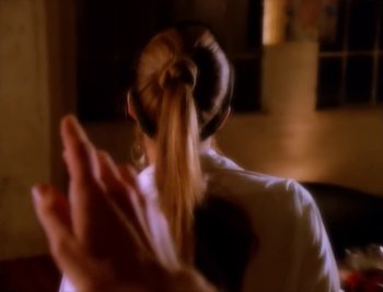 Movie still from “Billy Idol - Cradle Of Love” (1990), directed by David Fincher – Extreme Close Up shot, Over the shoulder angle